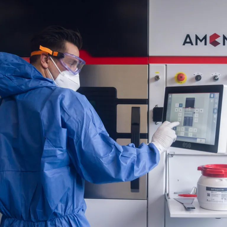 Operator in Protective Gear Operating the Control Panel of an AMCM M 290 FDR